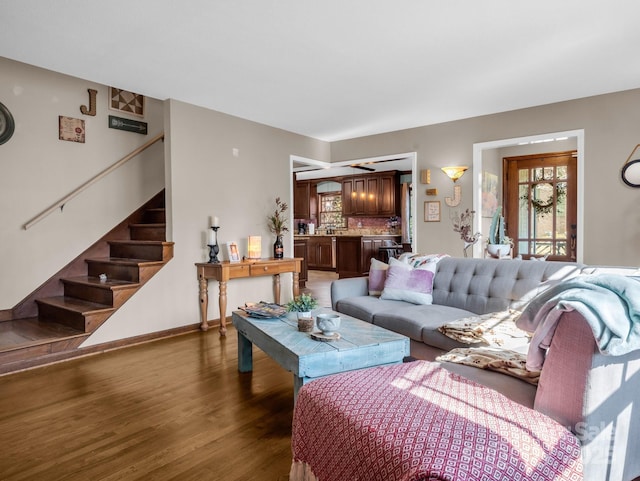 living room featuring plenty of natural light and dark wood-type flooring