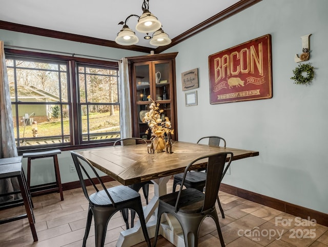 dining area featuring crown molding