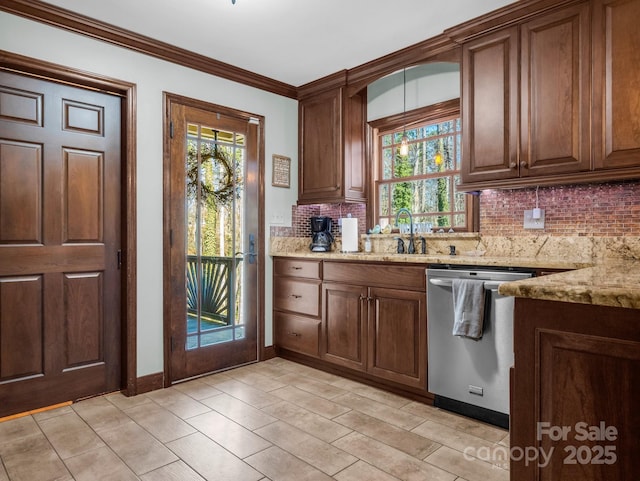 kitchen with backsplash, ornamental molding, stainless steel dishwasher, light stone counters, and plenty of natural light