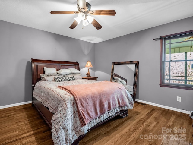 bedroom featuring dark wood-type flooring and ceiling fan