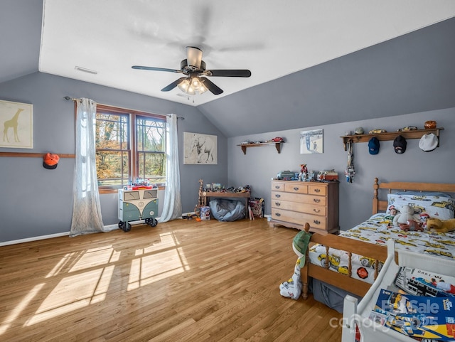 bedroom featuring ceiling fan, lofted ceiling, and light hardwood / wood-style floors