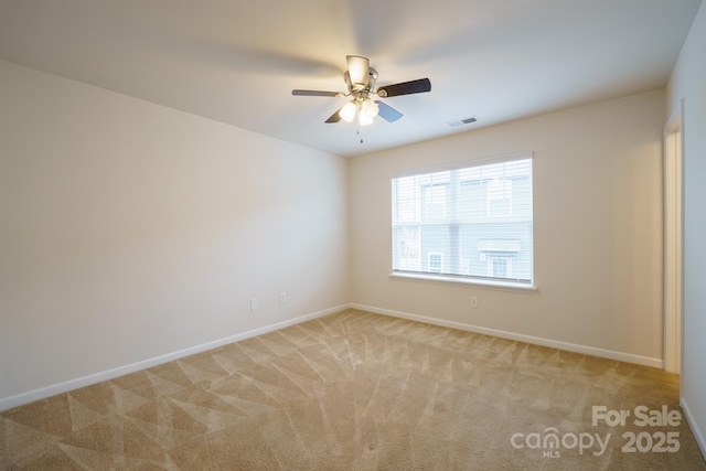 unfurnished room with light carpet and ceiling fan