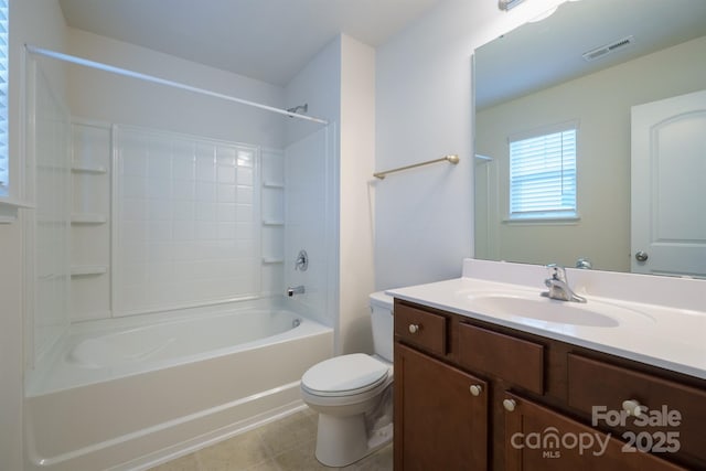 full bathroom featuring bathtub / shower combination, tile patterned floors, vanity, and toilet