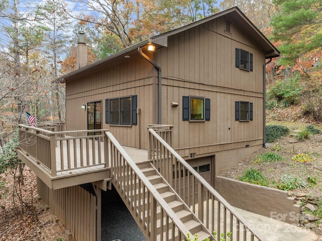 rear view of house featuring a deck