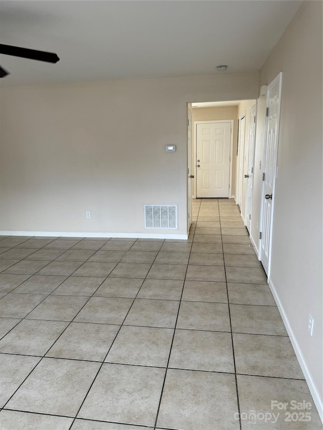 hallway with light tile patterned flooring