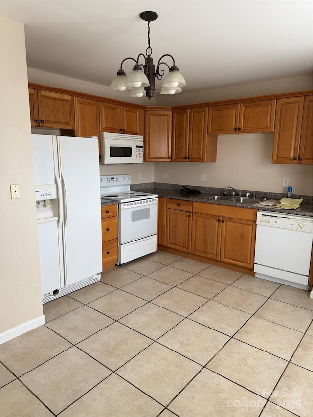 kitchen featuring sink, decorative light fixtures, a chandelier, light tile patterned floors, and white appliances