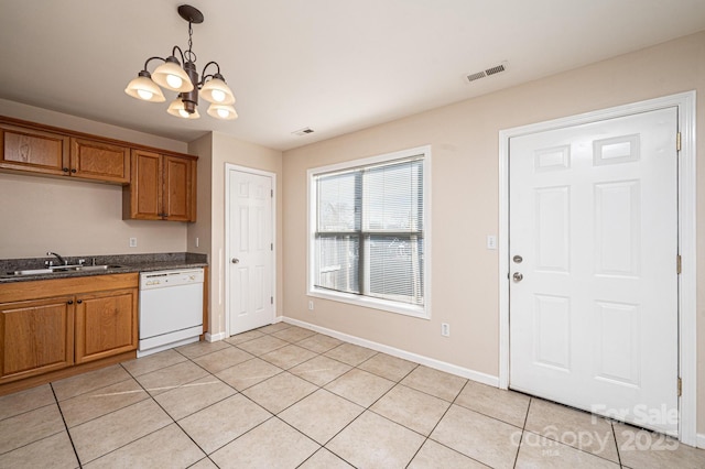 kitchen featuring sink, white dishwasher, a notable chandelier, light tile patterned flooring, and decorative light fixtures