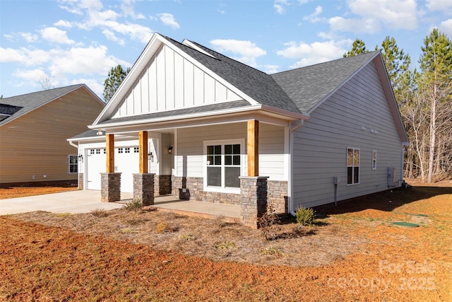 view of front facade with a garage and covered porch