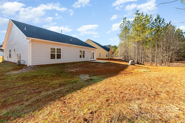 view of side of property with a yard