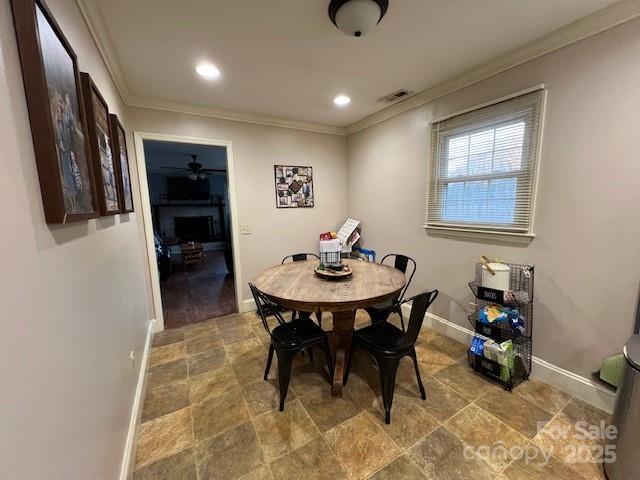 dining space featuring ornamental molding