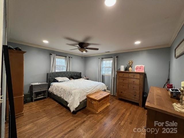 bedroom with multiple windows, ornamental molding, dark hardwood / wood-style floors, and ceiling fan