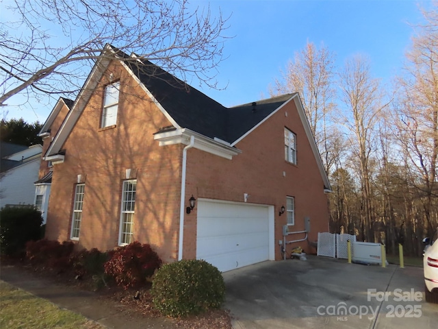 view of side of home with a garage