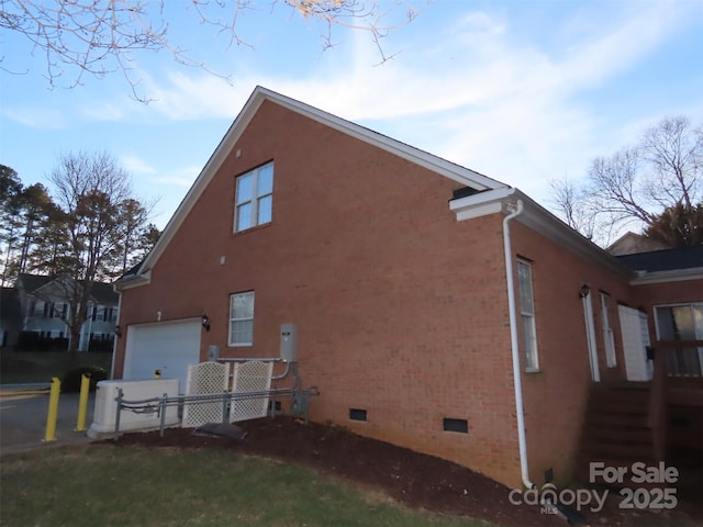 view of side of home with a garage