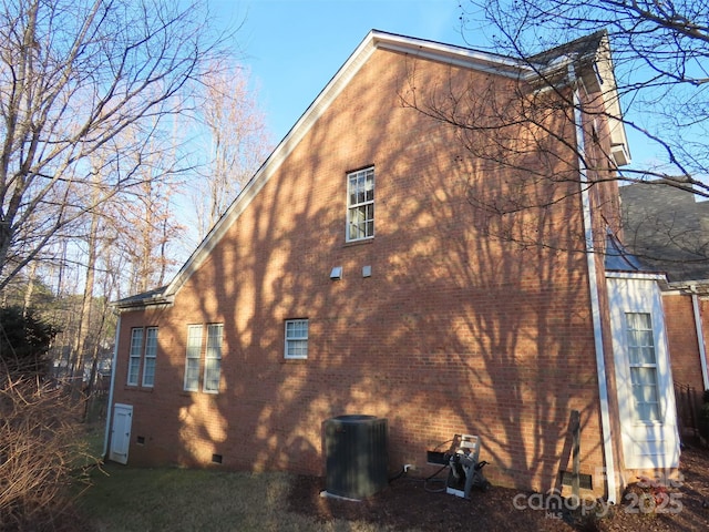 view of side of property featuring central AC