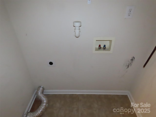 clothes washing area featuring electric dryer hookup, hookup for a washing machine, and tile patterned floors