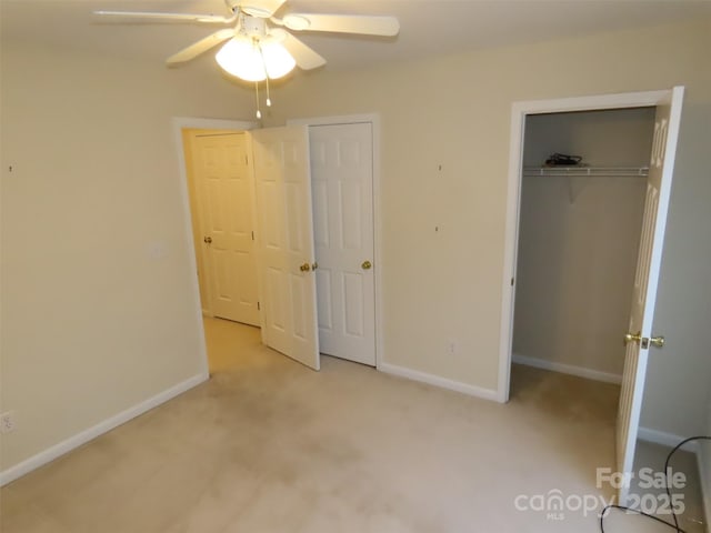 unfurnished bedroom with light colored carpet and ceiling fan