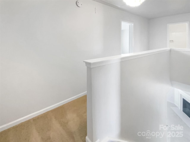 hallway featuring carpet floors