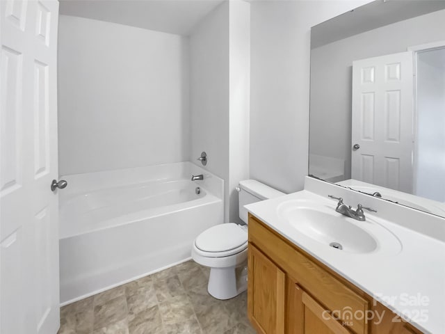 bathroom with vanity, toilet, and a washtub