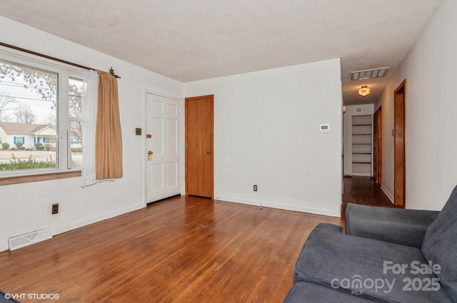 living room with dark wood-type flooring