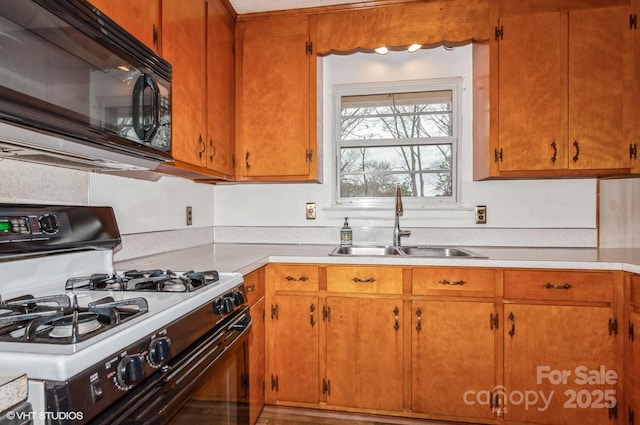 kitchen with sink and range with gas stovetop