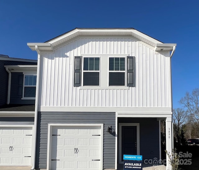 view of front of property featuring an attached garage and board and batten siding