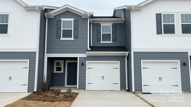 townhome / multi-family property featuring a garage and concrete driveway