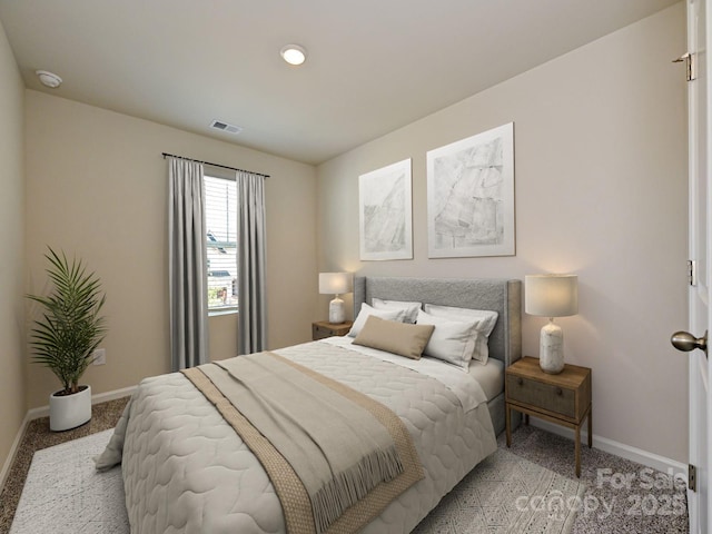 bedroom featuring carpet flooring, visible vents, and baseboards