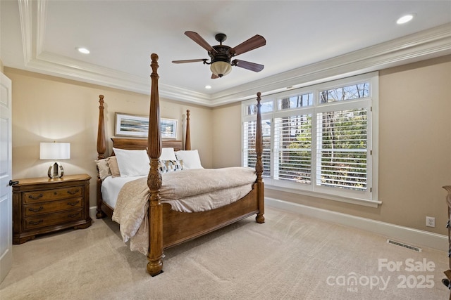 bedroom featuring crown molding, light colored carpet, and ceiling fan