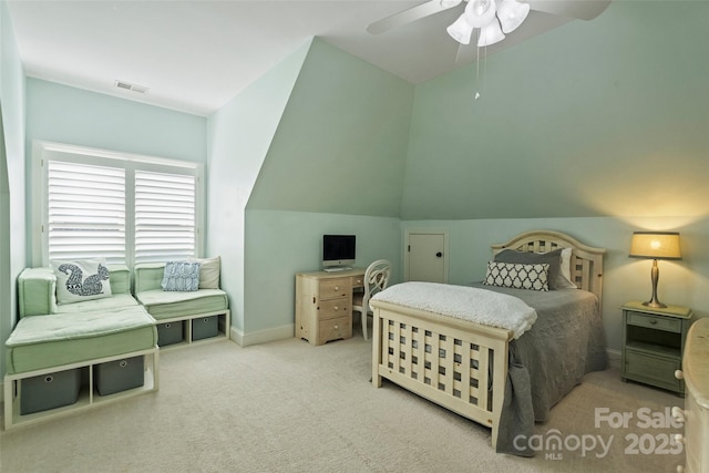 carpeted bedroom with ceiling fan and lofted ceiling