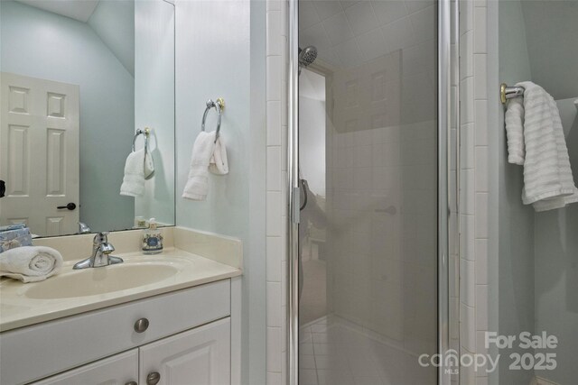 bathroom with vanity and an enclosed shower