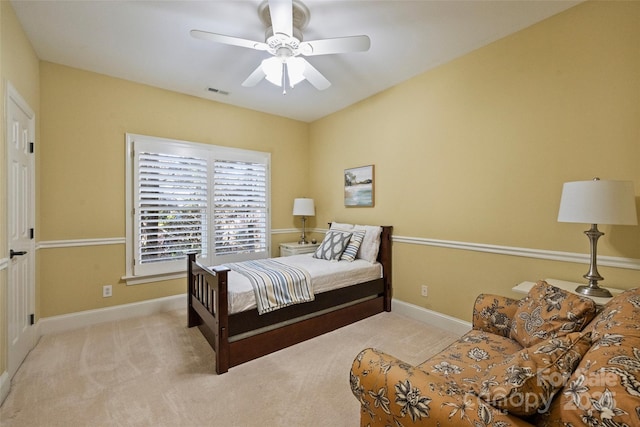 bedroom with light colored carpet and ceiling fan