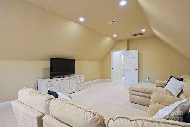 living room with vaulted ceiling and light colored carpet