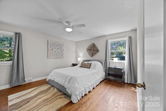 bedroom featuring hardwood / wood-style floors and ceiling fan