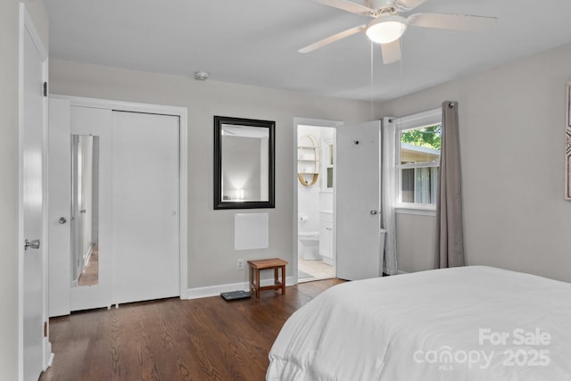 bedroom with ensuite bathroom, dark hardwood / wood-style floors, ceiling fan, and a closet