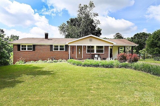 ranch-style home with a front lawn