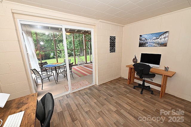 office area with hardwood / wood-style flooring and crown molding