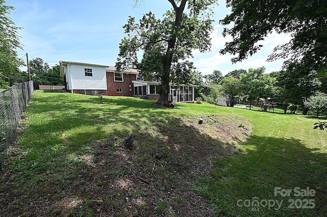 view of yard featuring a sunroom