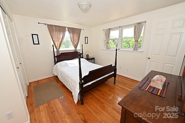 bedroom with wood-type flooring