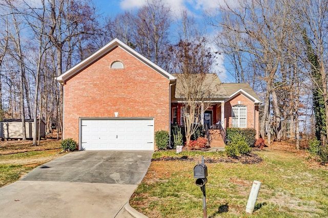 view of front of home with a garage and a front lawn