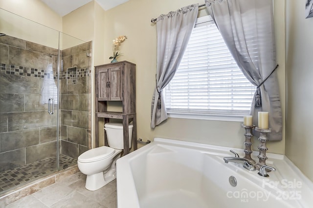 bathroom featuring toilet and a shower with door