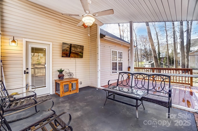 view of patio / terrace featuring ceiling fan and a deck