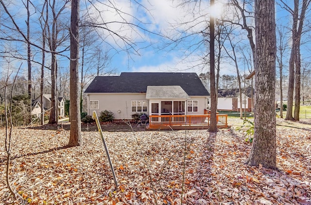 back of property featuring a deck