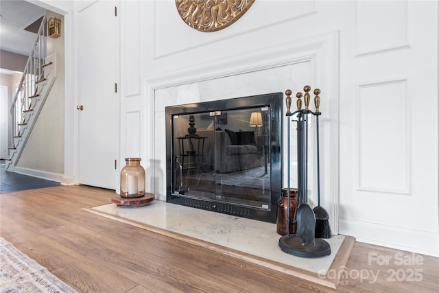 details featuring wood finished floors and baseboards