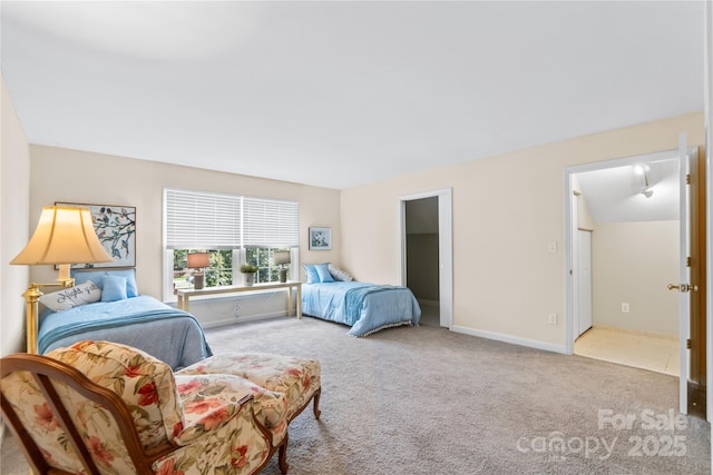 bedroom with carpet and baseboards