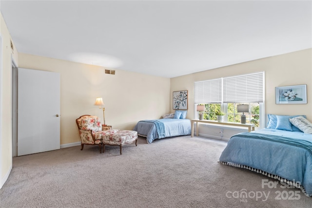 carpeted bedroom with baseboards and visible vents