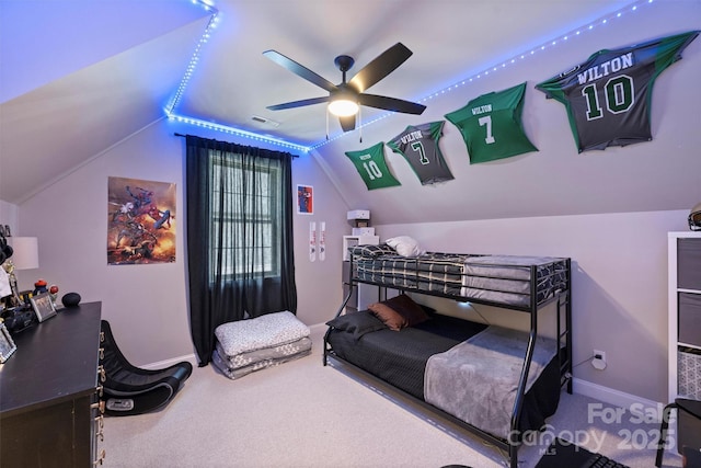 carpeted bedroom featuring lofted ceiling and ceiling fan