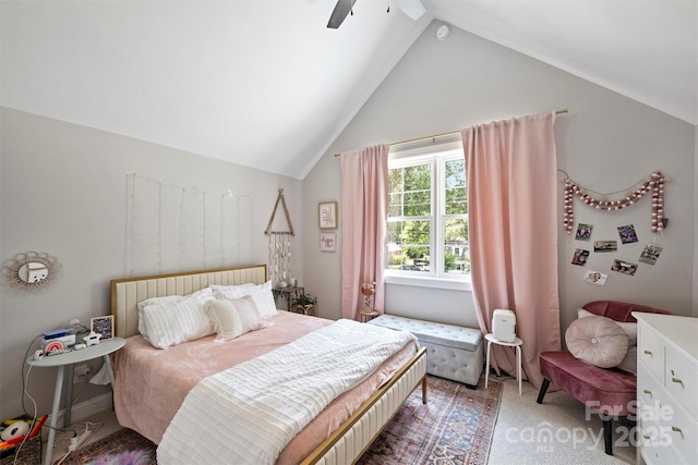 carpeted bedroom featuring ceiling fan and vaulted ceiling