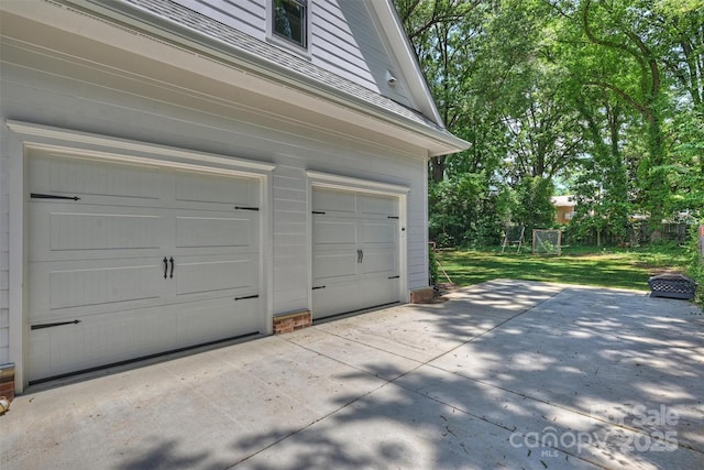 garage with a lawn