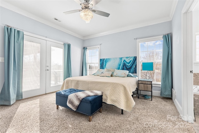 carpeted bedroom featuring multiple windows, ornamental molding, and access to outside