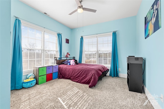 carpeted bedroom featuring ceiling fan